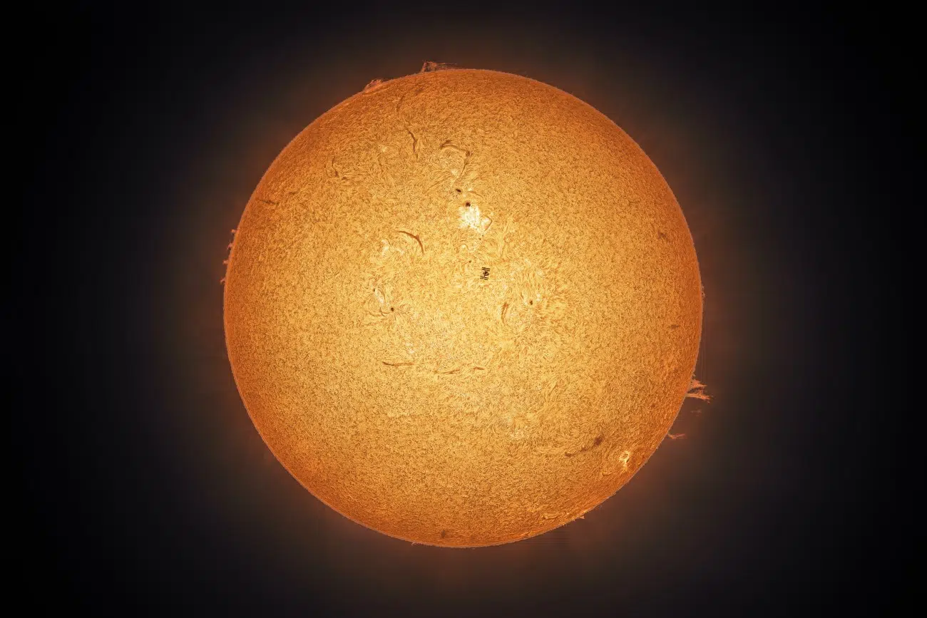 ISS passing in front of Sun during a solar flare by Andrew McCarthy