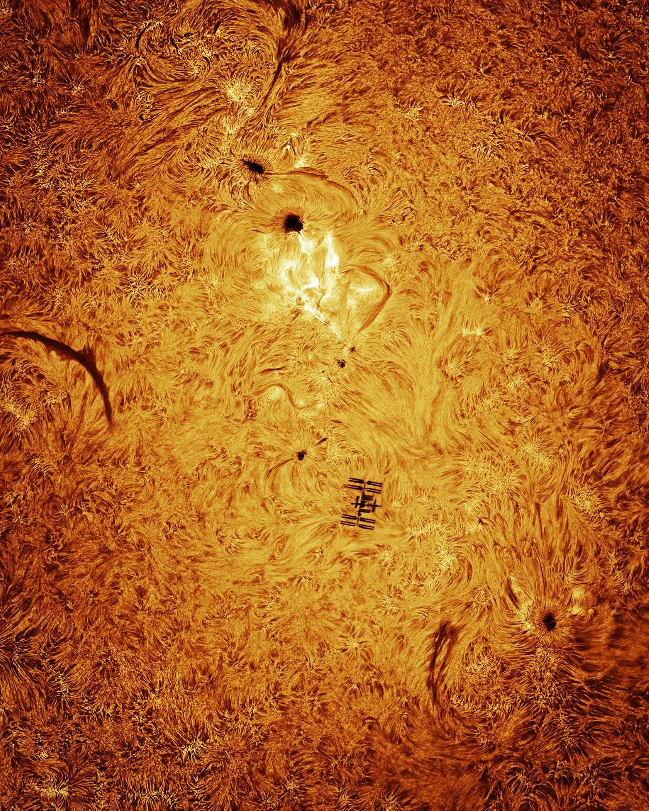 ISS passing in front of Sun during a solar flare by Andrew McCarthy