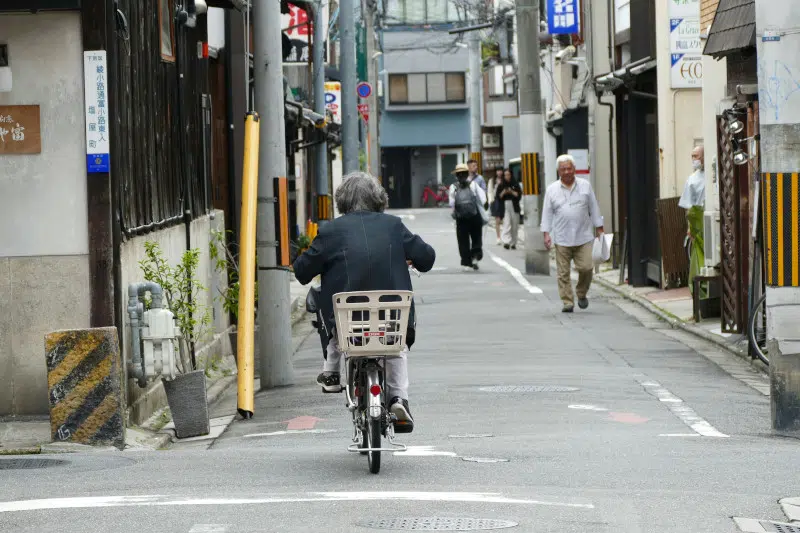 Grandma on a bike from behind in Japan