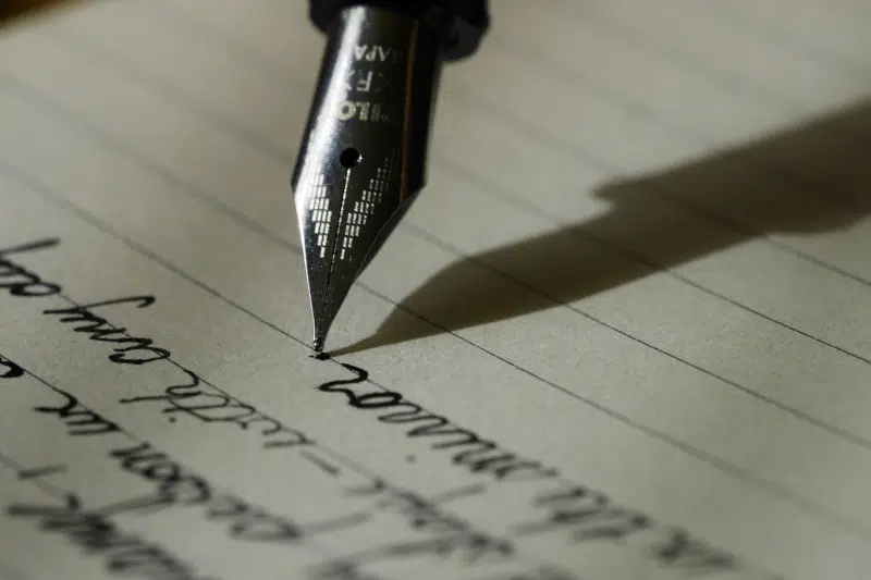Pen over a letter